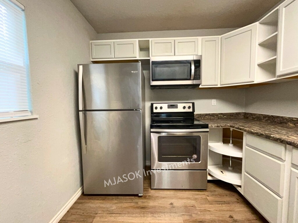Refrigerator, electric range, and over-range microwave included
