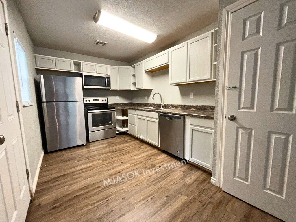 Kitchen with stainless steel appliances and full counter run